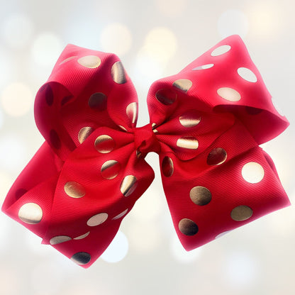 Girls 7in pink grosgrain hair bow with metallic gold polka dots on an alligator clip on Tampa Home & Garden Store