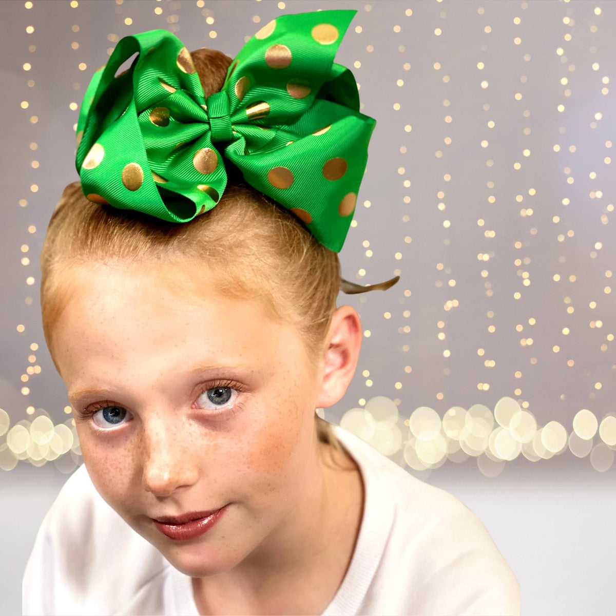 Green grosgrain hair bow with gold polka dots on alligator clip on Tampa Home & Garden Store