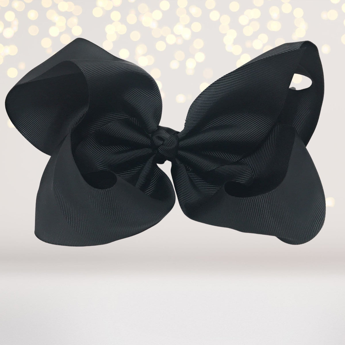 8-inch black satin hair bow on alligator clip from Chicky Chicky Bling Bling on Tampa Home & Garden Store