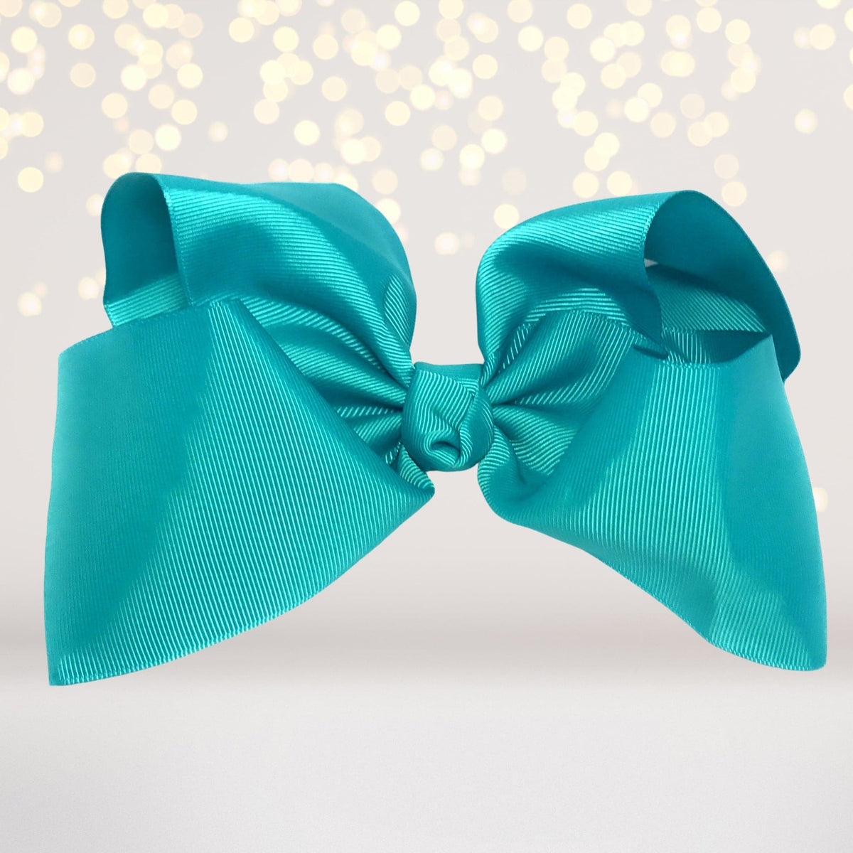 Girls 8-inch teal satin hair bow on alligator clip on Tampa Home & Garden Store