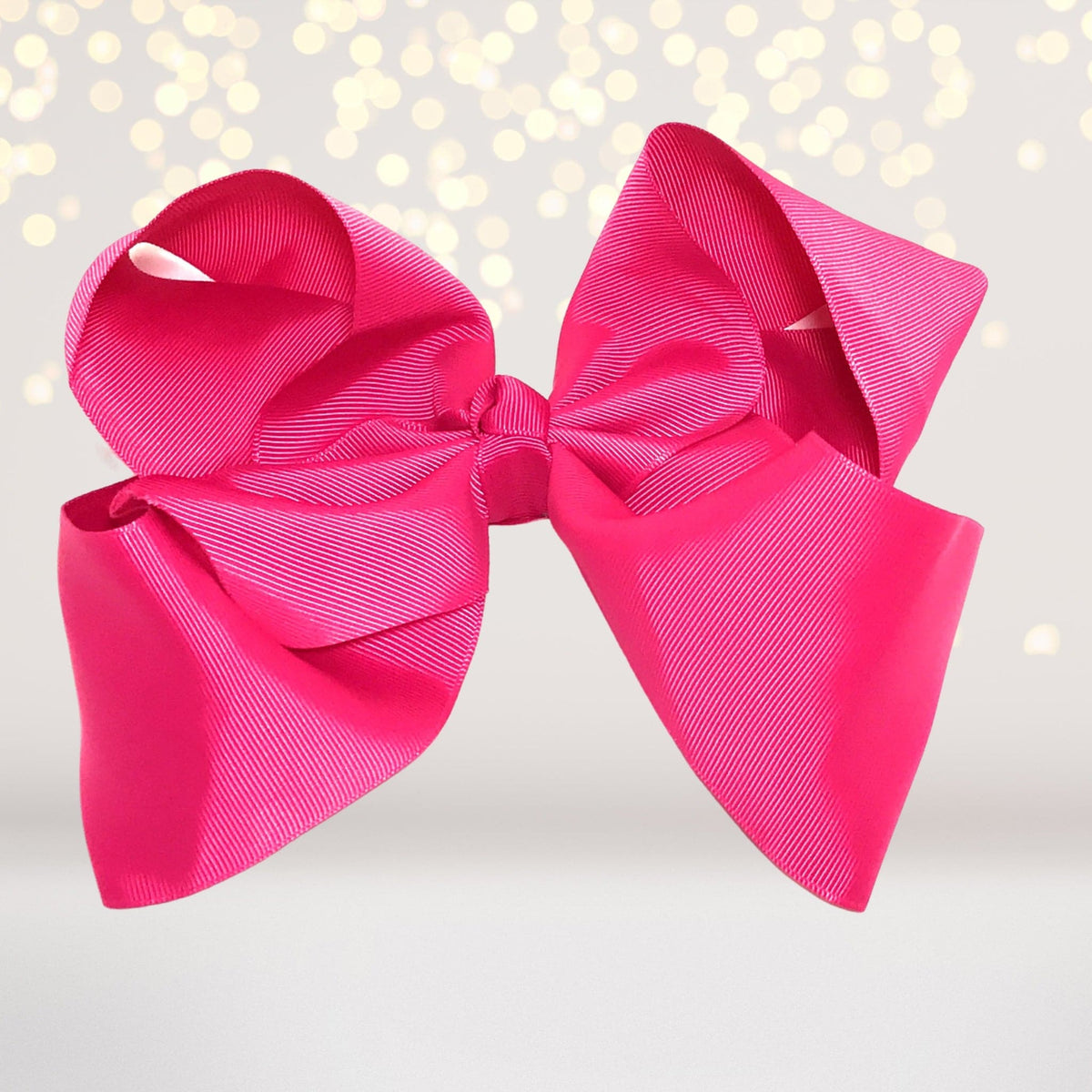 Girls 8 Inch Wide Basic Hair Bow on Alligator Clip, bright pink satin with diagonal stripes on Tampa Home & Garden Store
