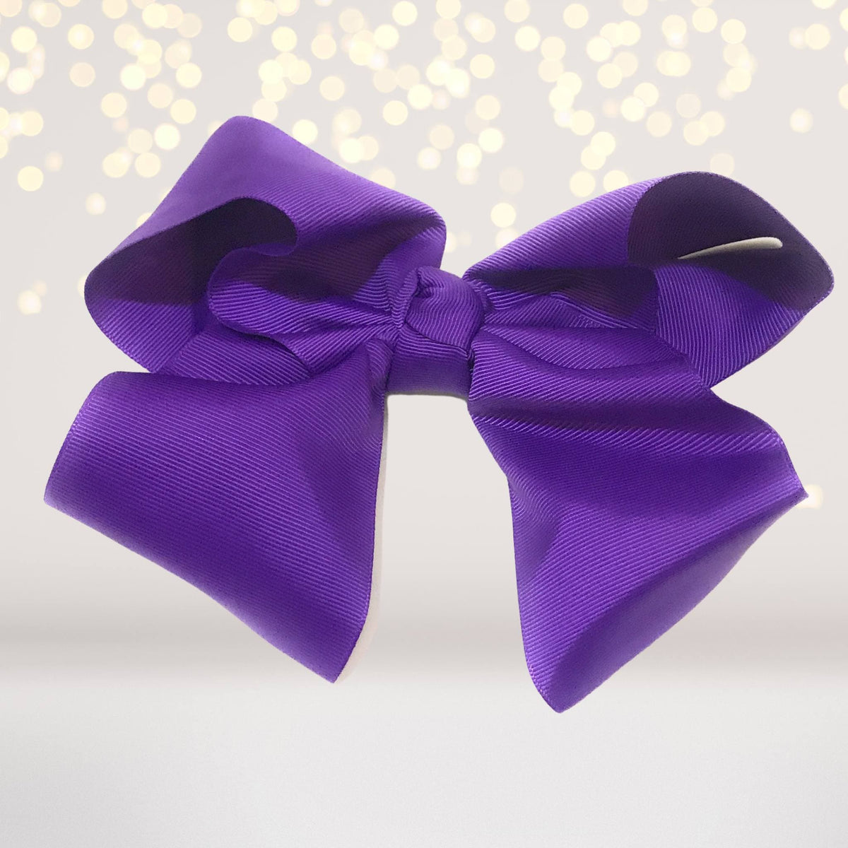 Girls 8 Inch Wide Purple Satin Hair Bow on Alligator Clip on Tampa Home & Garden Store
