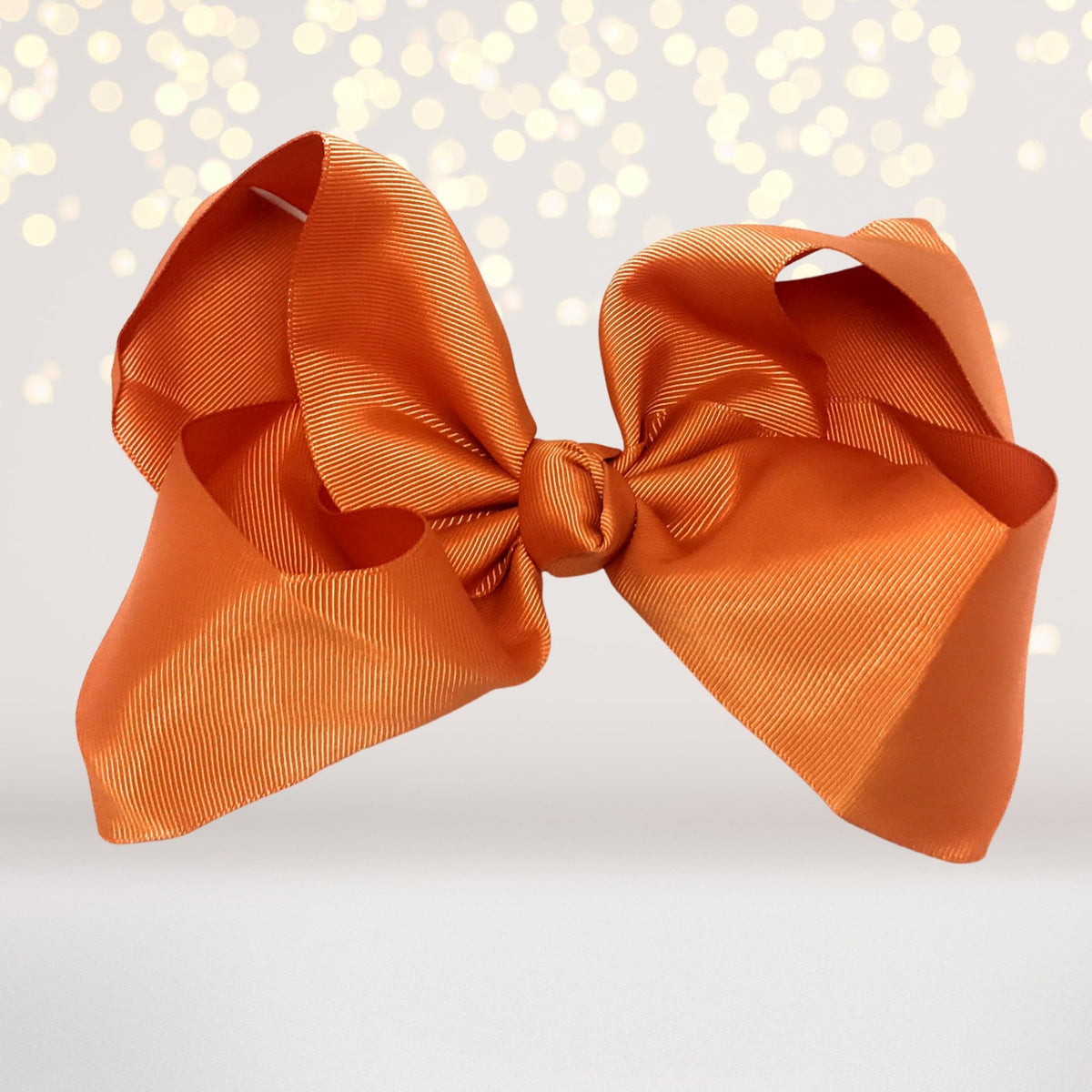 Girls 8 Inch Wide Basic Hair Bow on Alligator Clip orange satin ribbon bow on Tampa Home & Garden Store