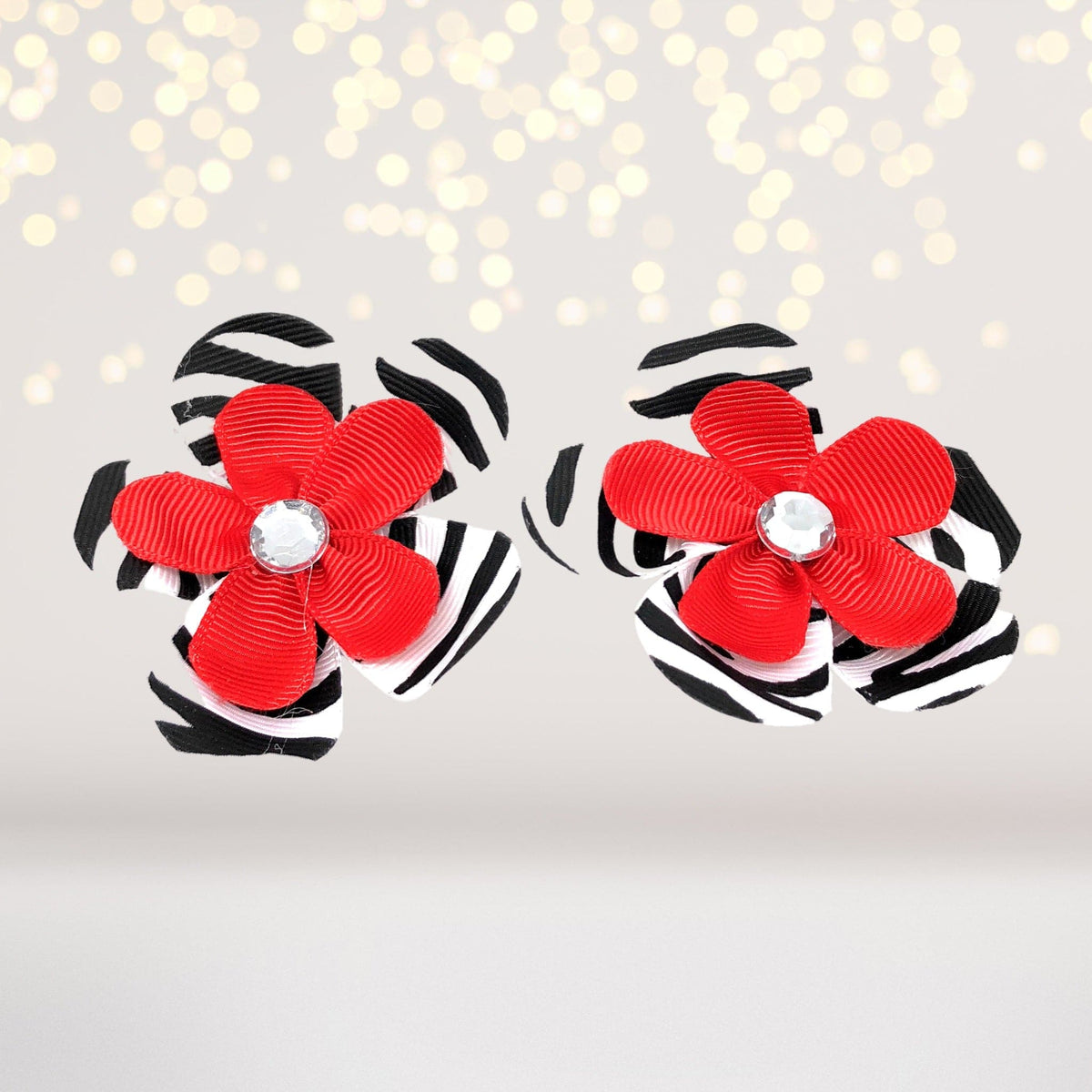 Pair of Chicky Chicky Bling Bling hair clips, red flowers on zebra-striped base with crystals on Tampa Home & Garden Store