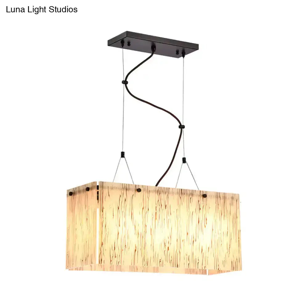 Modern bamboo and black glass island pendant light with bamboo shade and suspended cables on Tampa Home & Garden Store