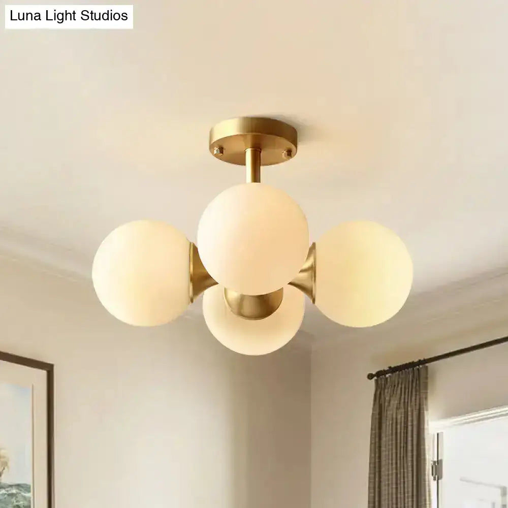 Gold opaline ceiling fixture Decorbites with brass finish and five frosted globes flush mount on Tampa Home & Garden Store