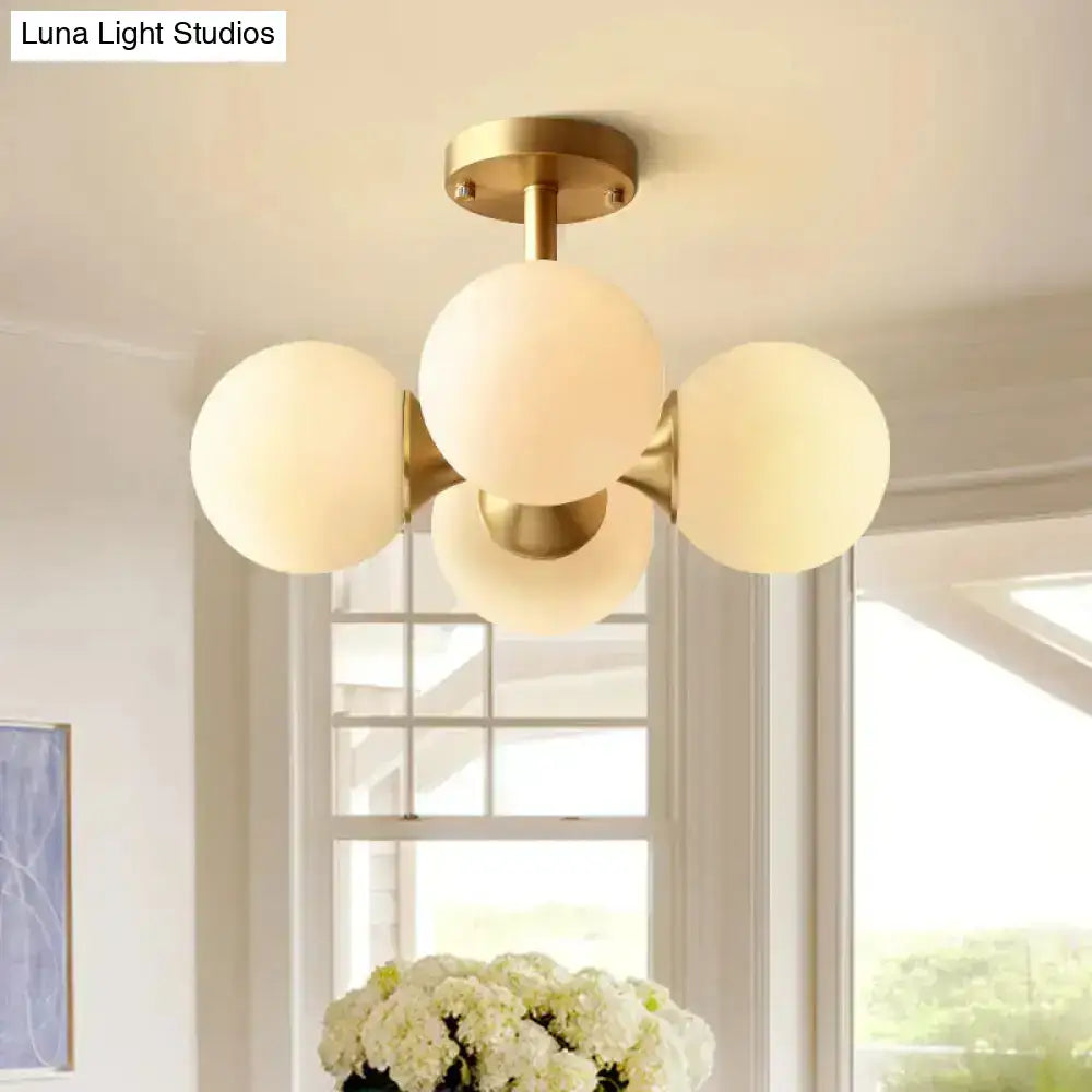 Gold opaline ceiling fixture flush mount light with four frosted glass globes in brass finish on Tampa Home & Garden Store
