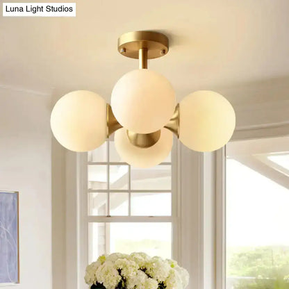 Gold opaline ceiling fixture flush mount light with four frosted glass globes in brass finish on Tampa Home & Garden Store