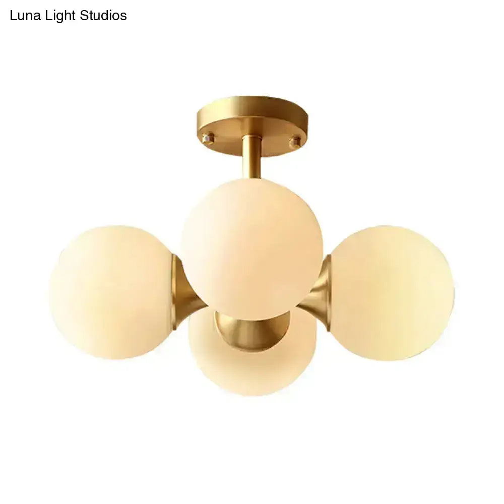 Decorbites gold opaline flush-mount ceiling fixture with five frosted glass globes on Tampa Home & Garden Store