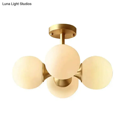 Decorbites gold opaline flush-mount ceiling fixture with five frosted glass globes on Tampa Home & Garden Store