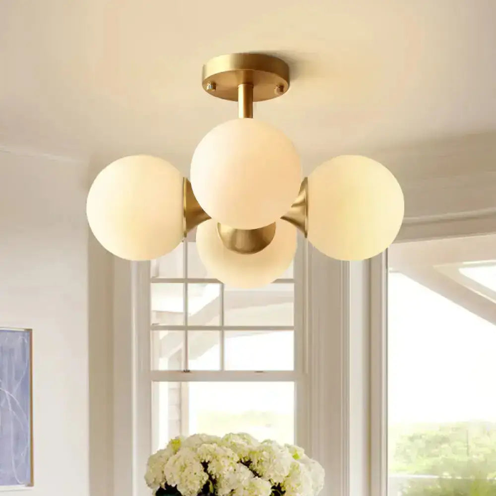 Gold opaline ceiling fixture with four frosted glass globes and brass mount Decorbites on Tampa Home & Garden Store