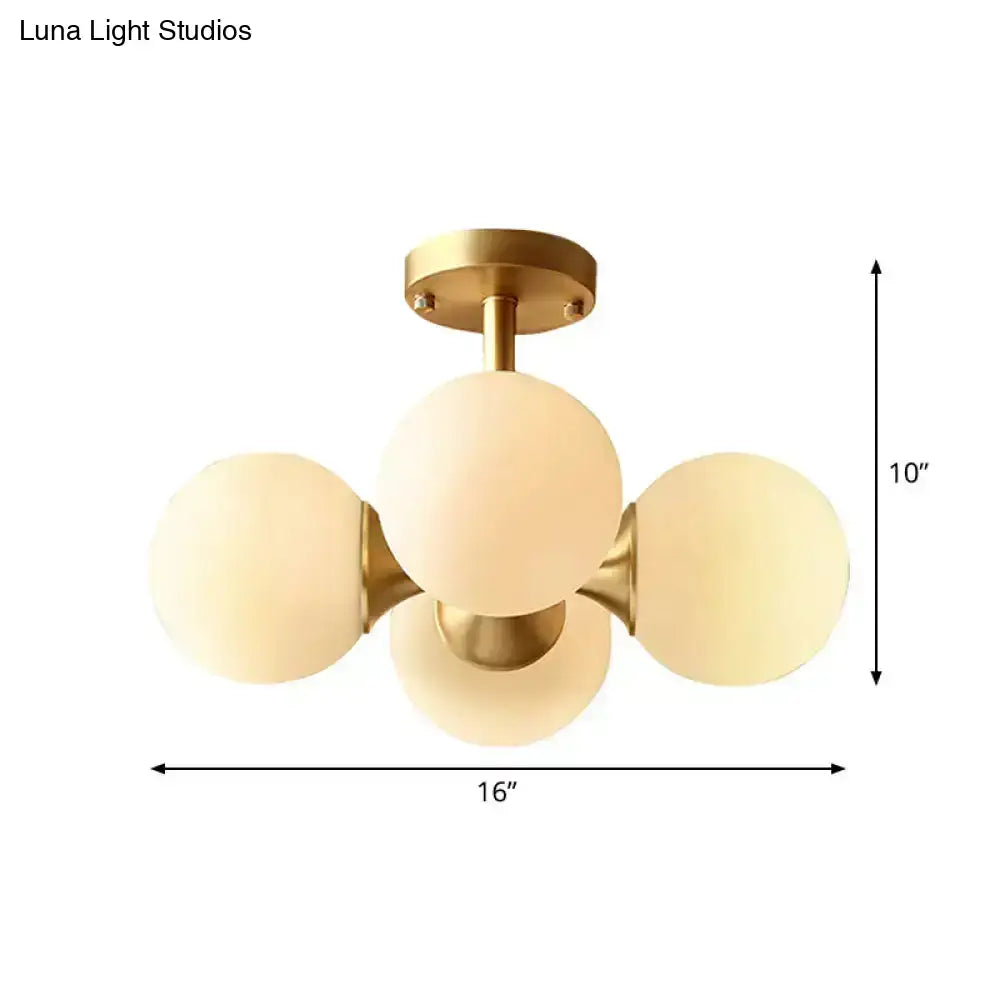 Gold opaline ceiling fixture with four globes on brass frame 16 in wide by 10 in high on Tampa Home & Garden Store