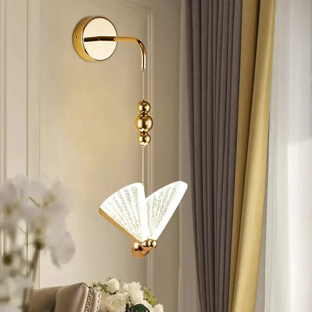 Gold Butterfly LED Wall Light by Decorbites with curved arm and butterfly wing ornament on Tampa Home & Garden Store