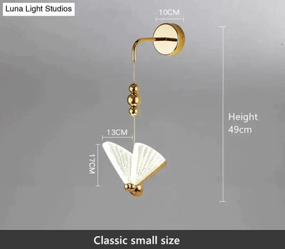 Gold Butterfly LED Wall Light Decorbites, gold finish with butterfly shade, wall-mounted on Tampa Home & Garden Store