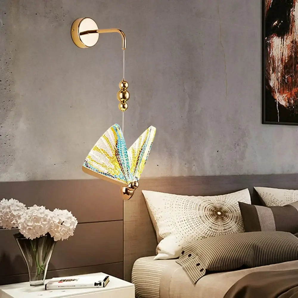 Decorbites Gold Butterfly LED Wall Light with butterfly shade mounted on wall for modern decor on Tampa Home & Garden Store