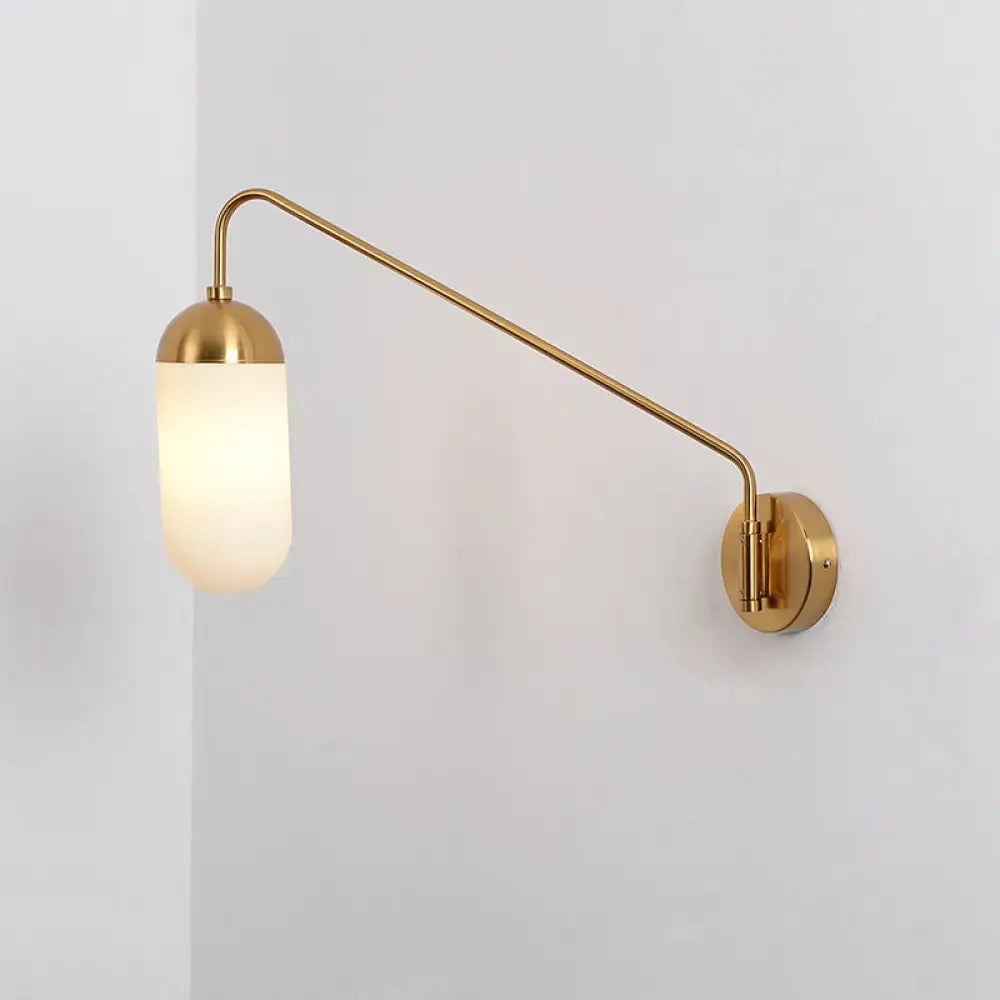 Brass wall sconce with curved arm and frosted glass shade by Decorbites on Tampa Home & Garden Store