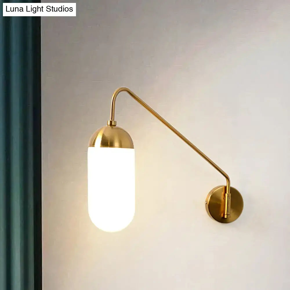 Brass frosted wall sconce with curved arm and cylindrical glass shade Decorbites on Tampa Home & Garden Store