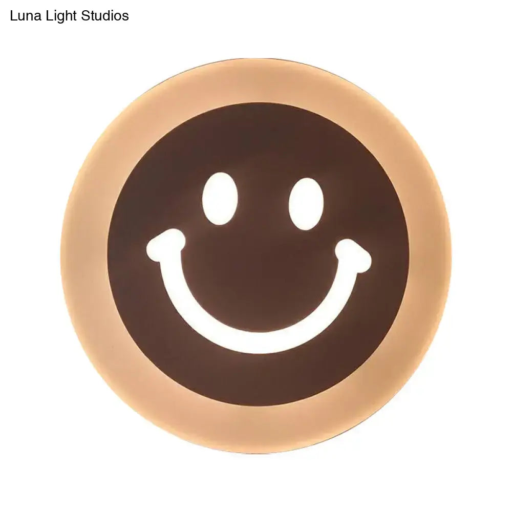 Gold Crescent LED Sconce with warm halo glow and smiley face center on Tampa Home & Garden Store