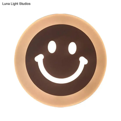 Gold Crescent LED Sconce with warm halo glow and smiley face center on Tampa Home & Garden Store