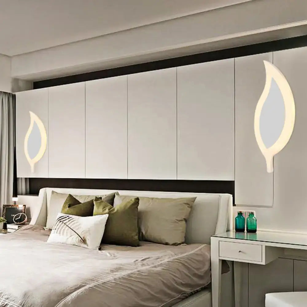 Gold Crescent LED Sconce pair by Decorbites with warm glow on modern white bedroom wall on Tampa Home & Garden Store
