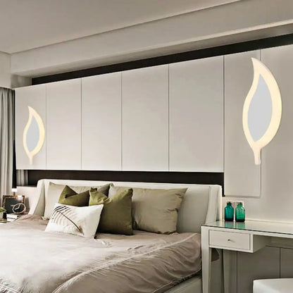 Gold Crescent LED Sconce pair by Decorbites with warm glow on modern white bedroom wall on Tampa Home & Garden Store