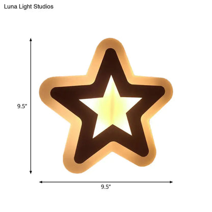Decorbites gold star LED sconce with black inner star silhouette and warm halo glow 9.5 in on Tampa Home & Garden Store