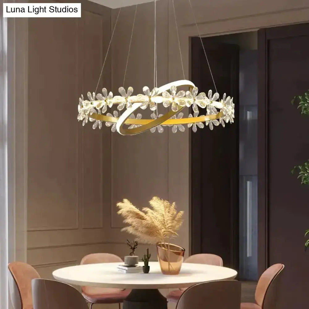 Pendant light gold crown crystal flower by Decorbites above a round dining table on Tampa Home & Garden Store