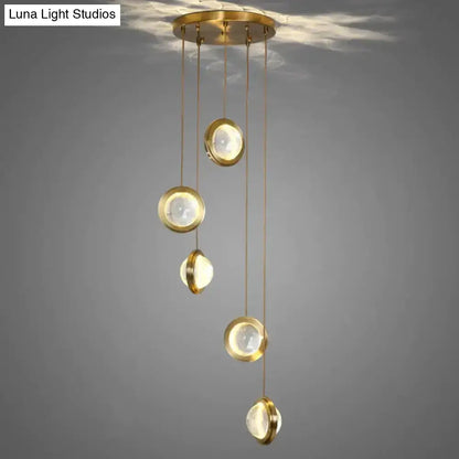 Pendant light with gold crystal glass discs and LED cascade for dining room and kitchen decor on Tampa Home & Garden Store