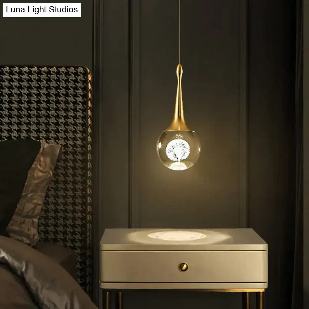 Gold crystal glass LED pendant light by Decorbites over a white nightstand on Tampa Home & Garden Store