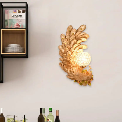 Golden peacock wall light with crystal shade by Decorbites, wall-mounted feather motif on Tampa Home & Garden Store