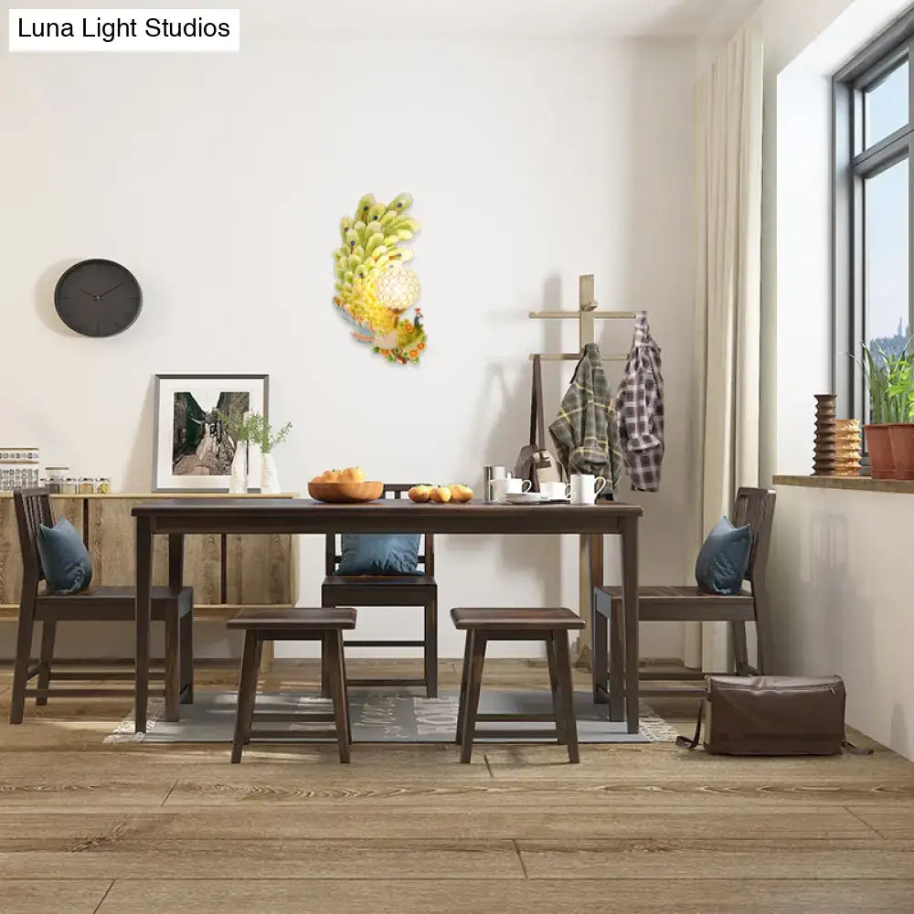Golden peacock wall light with crystal shade in living room, yellow and green Decorbites on Tampa Home & Garden Store