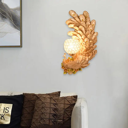 Golden peacock wall light with crystal shade, gold feather-back plate for living room decor on Tampa Home & Garden Store