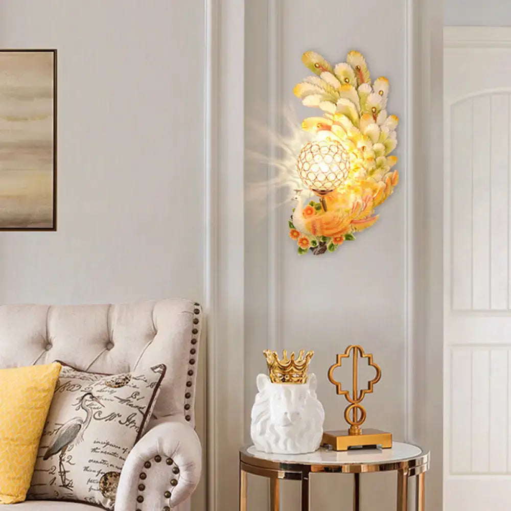 Golden peacock wall light by Decorbites with crystal shade in yellow and green on Tampa Home & Garden Store