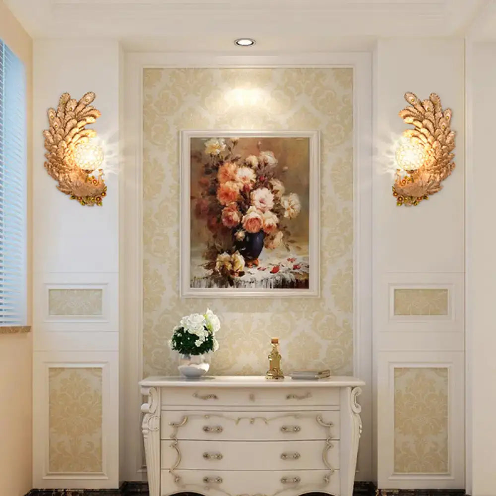 Pair of golden peacock wall lights with crystal shades in a living room decor setting on Tampa Home & Garden Store