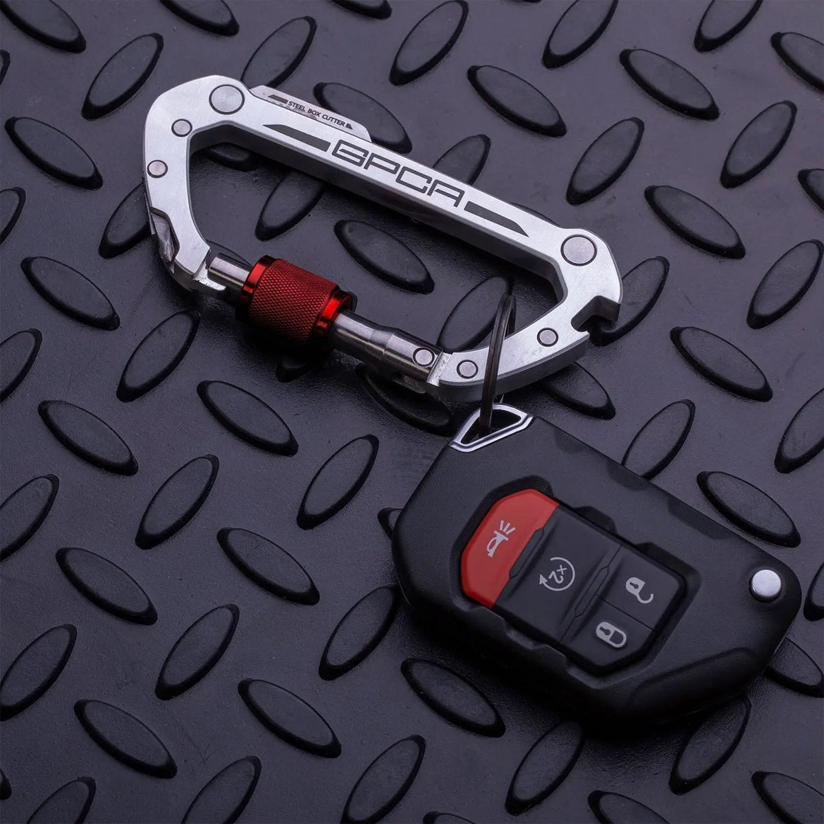 GPCA Carabiner PRO EDC multitool clip aluminum with red knurled knob on diamondplate on Tampa Home & Garden Store