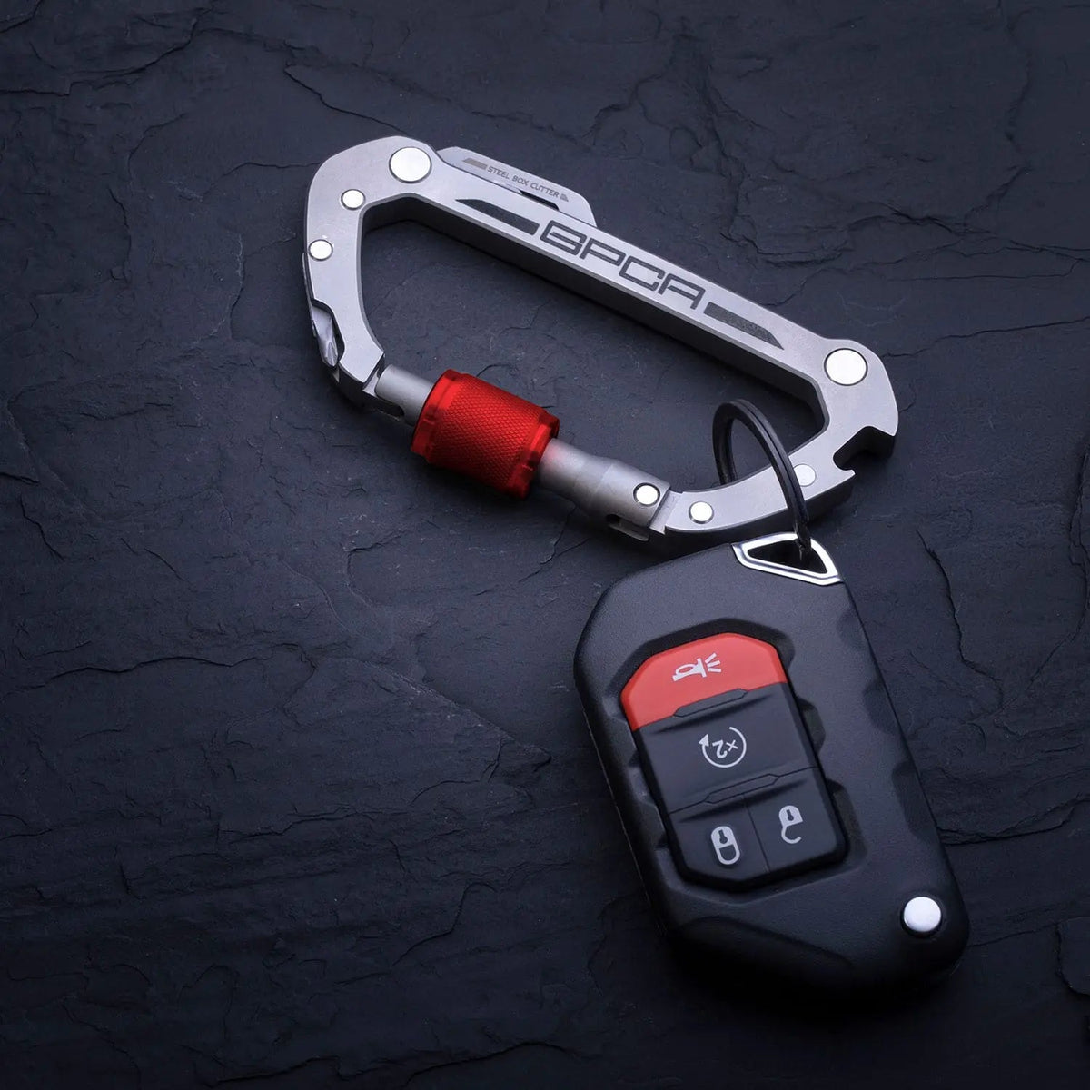 GPCA Carabiner PRO EDC clip in silver aluminum with red quick-release adapter on a key fob on Tampa Home & Garden Store