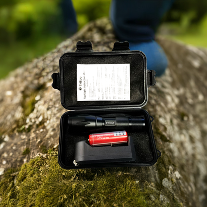 THEUS Rechargeable Flashlight Kit in a black hard case with a flashlight and red Li-ion battery on Tampa Home & Garden Store