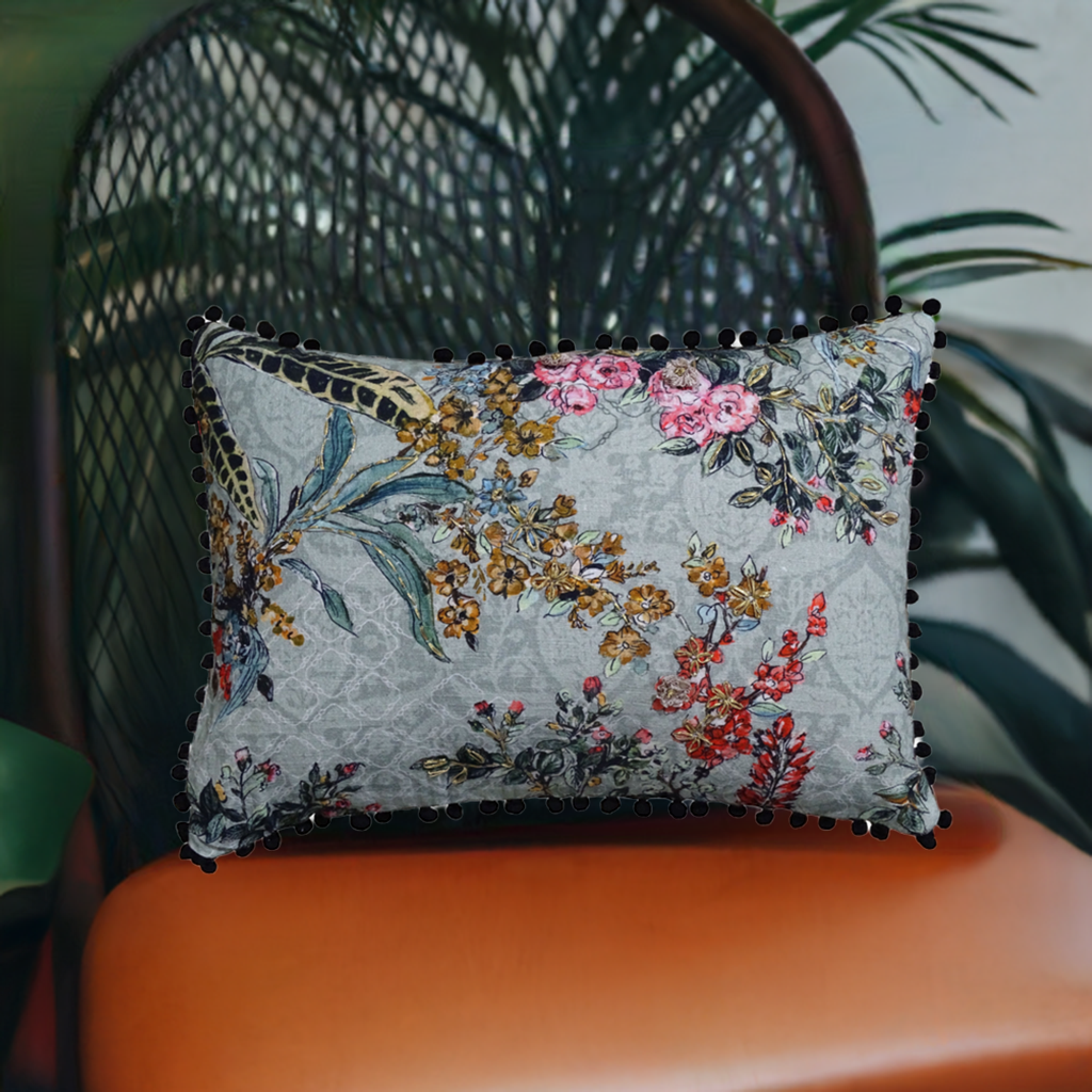 Vibhsa hand illustrated 14x20 decorative pillow with blue-gray floral print and black pom-pom trim on Tampa Home & Garden Store