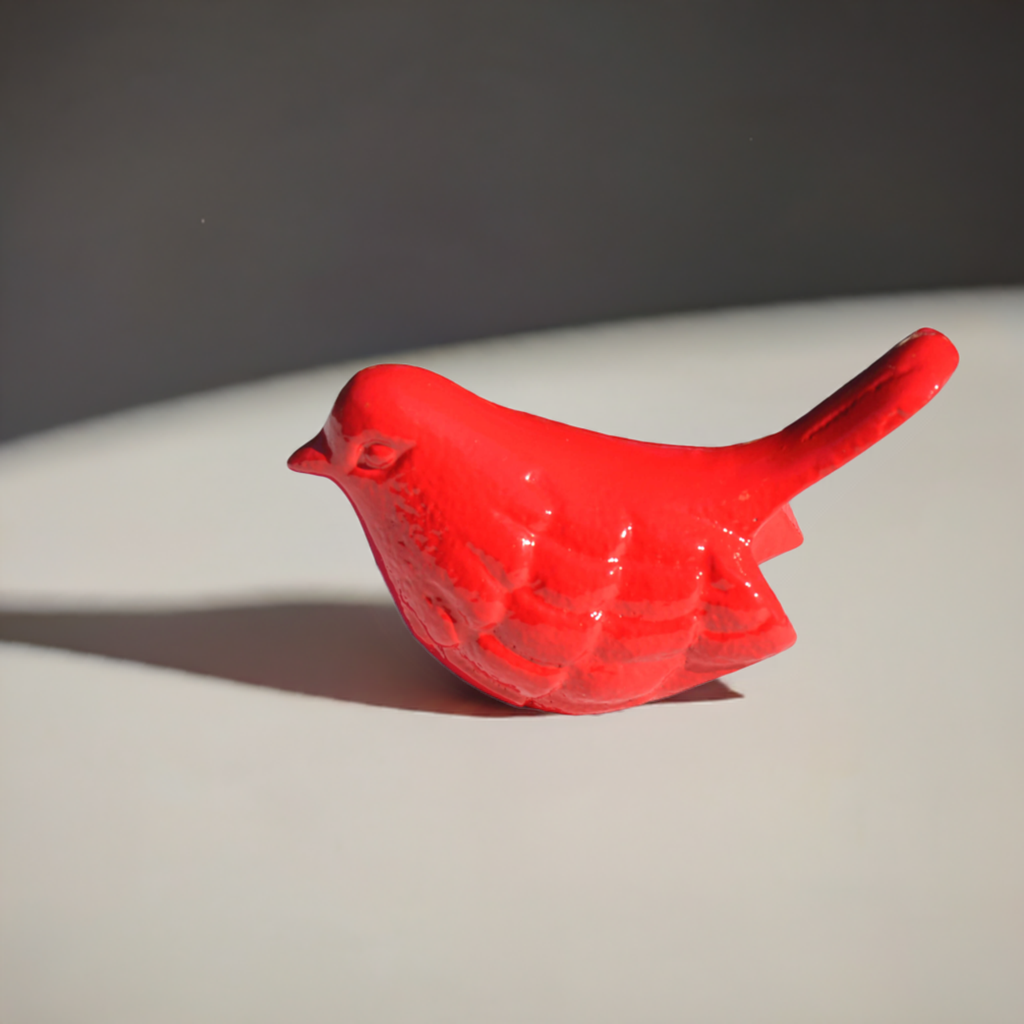 Vibhsa red bird figurine, glossy ceramic with smooth wing detailing on Tampa Home & Garden Store