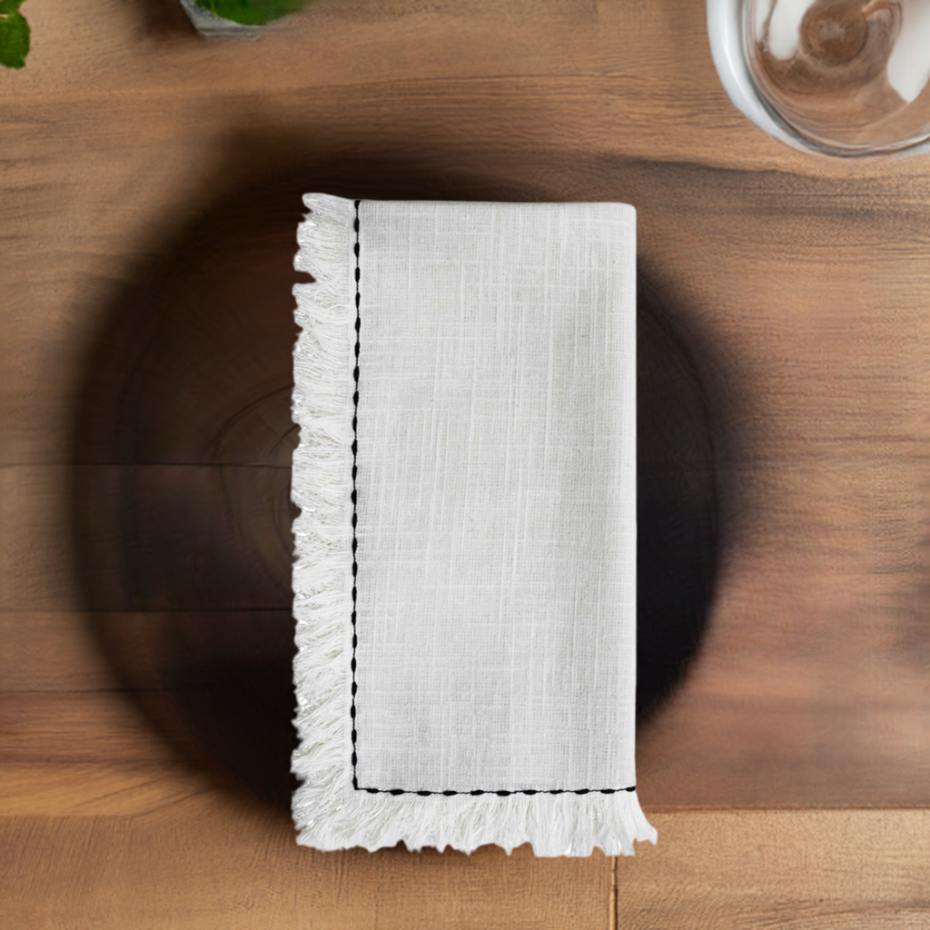 Vibhsa cotton table napkins set of 4, white with black embroidered border and fringe edges on Tampa Home & Garden Store