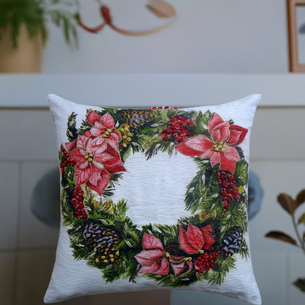 Vibhsa Christmas wreath throw pillow 20x20 white with red poinsettias, pinecones and greenery on Tampa Home & Garden Store