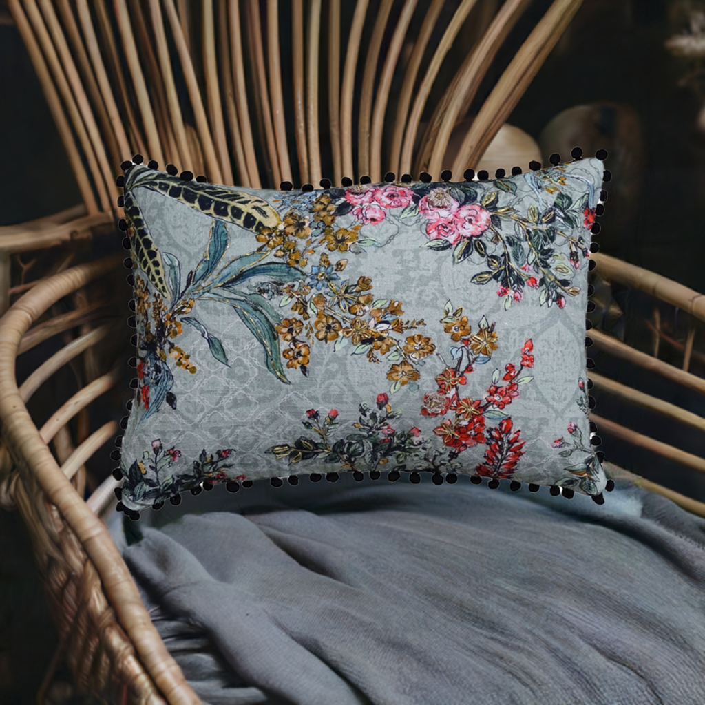 Vibhsa hand illustrated decorative throw pillow 14x20 with floral print and pom-pom trim on Tampa Home & Garden Store