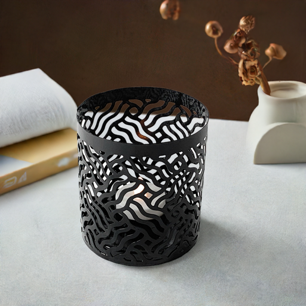 Vibhsa black laser-cut votive candle holder, metal with intricate wavy cutouts on Tampa Home & Garden Store