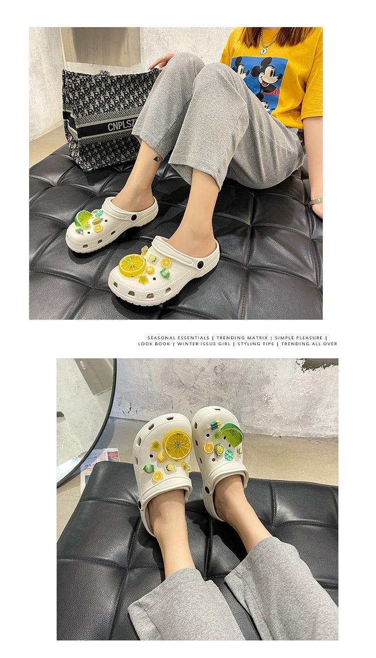 Pair of women's slip-on garden sandals with lemon slice decorations, white rubber clogs on Tampa Home & Garden Store

Pair of white slip-on sandals with citrus fruit embellishments, lightweight garden clogs on Tampa Home & Garden Store