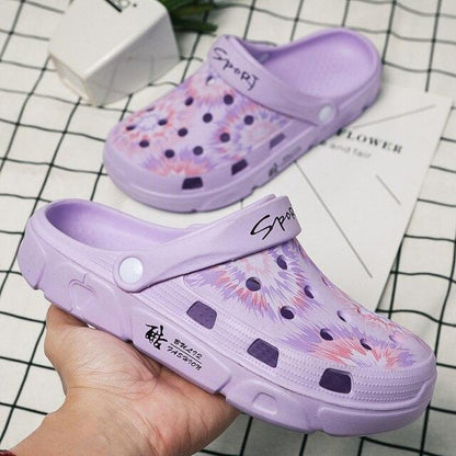 Pair of lavender Stevvex slip-on garden clogs with strap and ventilation holes on Tampa Home & Garden Store