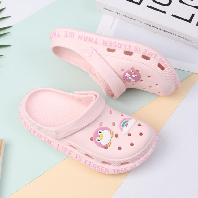 Pink Stevvex garden slippers with perforated holes and penguin charms (2 sandals) on Tampa Home & Garden Store