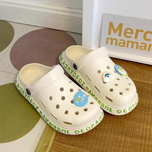 Stevvex white slip-on garden sandals with ventilation holes and blue charm on Tampa Home & Garden Store