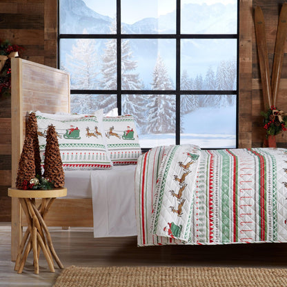 Christmas Quilt Great Bay Home red green reindeer pattern white quilt in cabin on Tampa Home & Garden Store