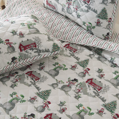 Holiday Quilt Alfie Great Bay Home with snowmen and trees on white quilt with red border on Tampa Home & Garden Store