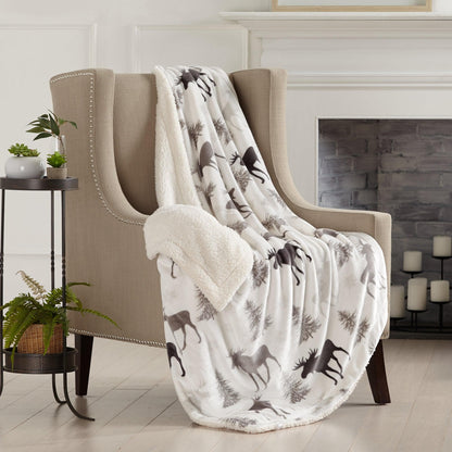 Velvet Plush Sherpa Blanket Cielo ivory tree pattern draped over beige sofa Great Bay Home on Tampa Home & Garden Store